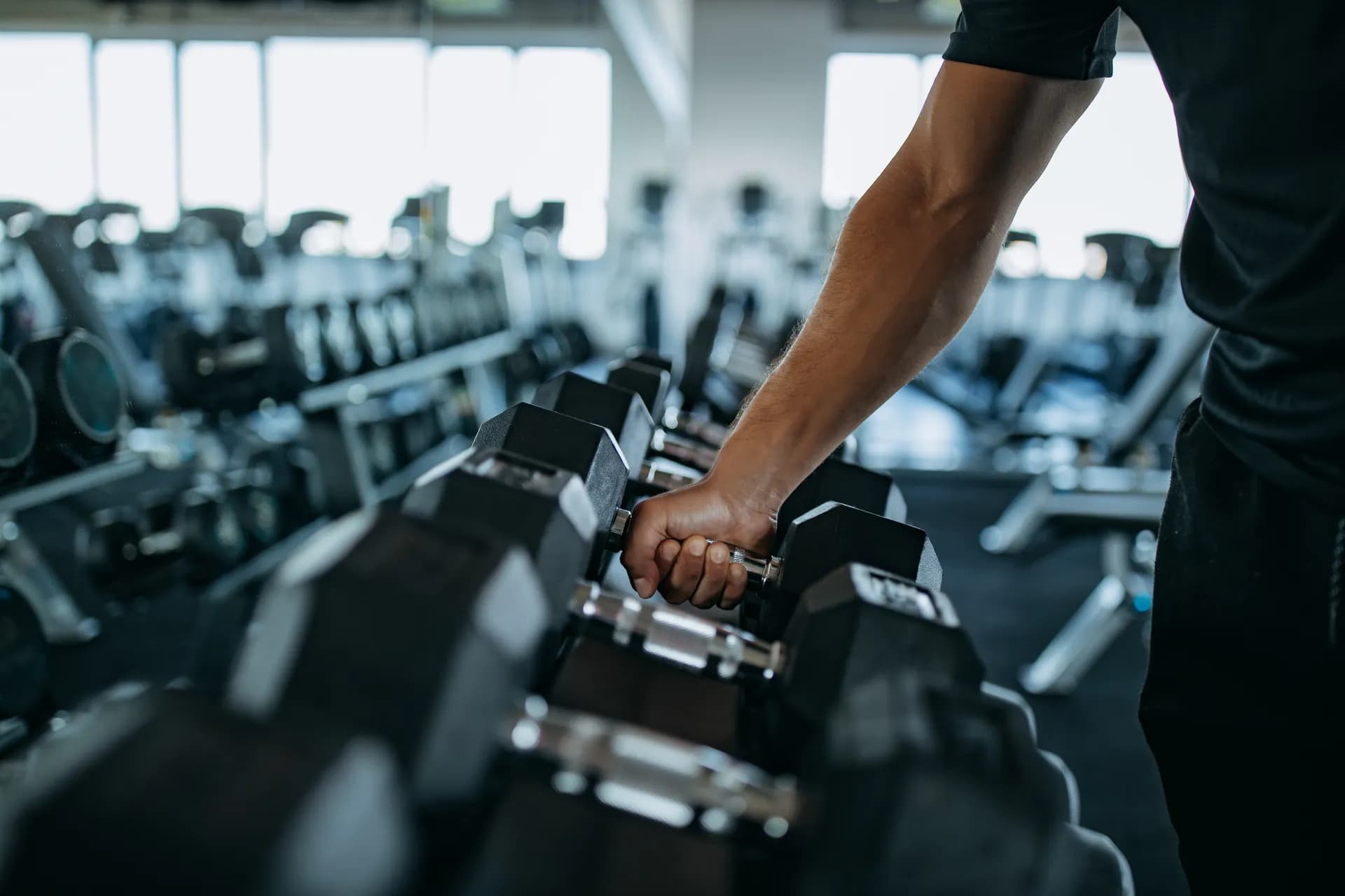 Dumbbells racked on a gym floor